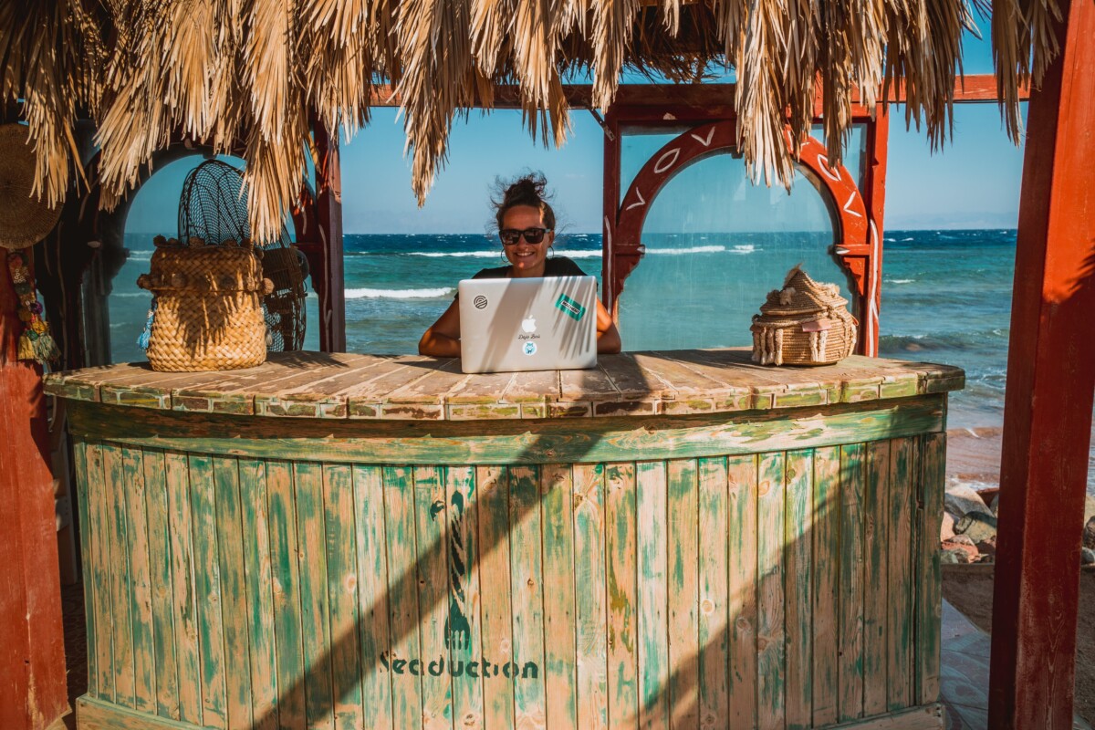 Digital nomad working from a beach