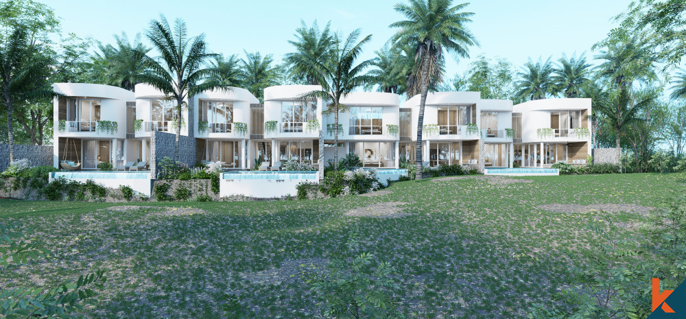 The image depicts a row of contemporary two-story villas with white facades, large windows, and spacious balconies. Each villa is adorned with natural stone accents and is surrounded by tropical palm trees, indicating a luxurious, serene environment. The landscape in front of the villas appears to be a well-maintained grassy area, suggesting an upscale residential development designed to integrate with a tropical setting.